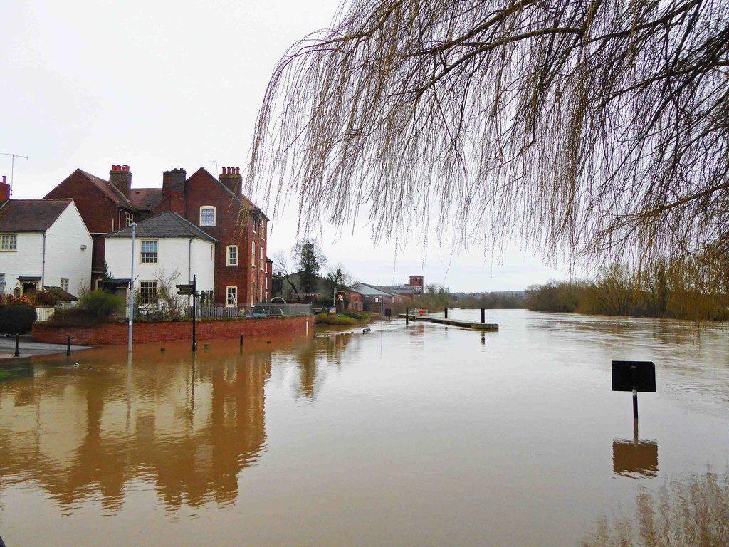 A house beside a river in flood